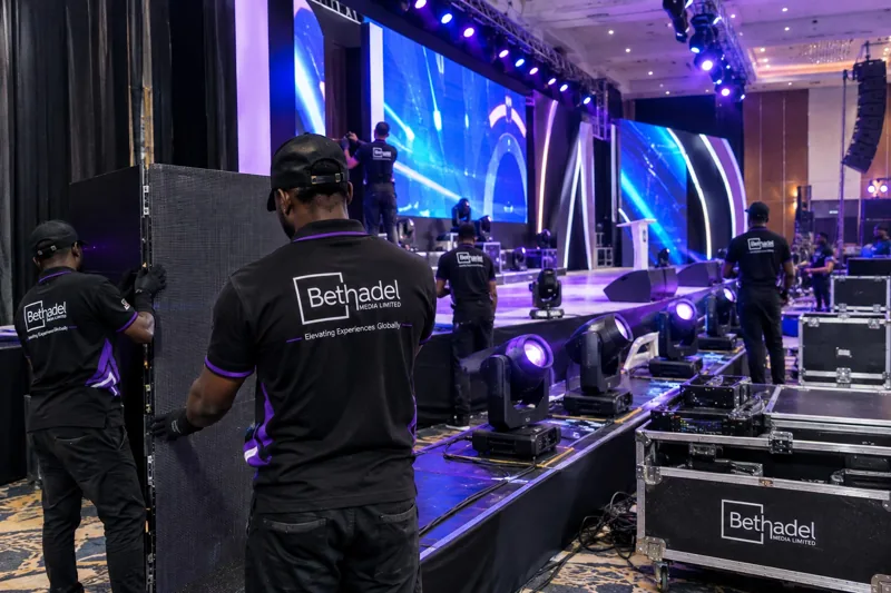 Bethadel crew rigging LED panels and moving lights ahead of a show